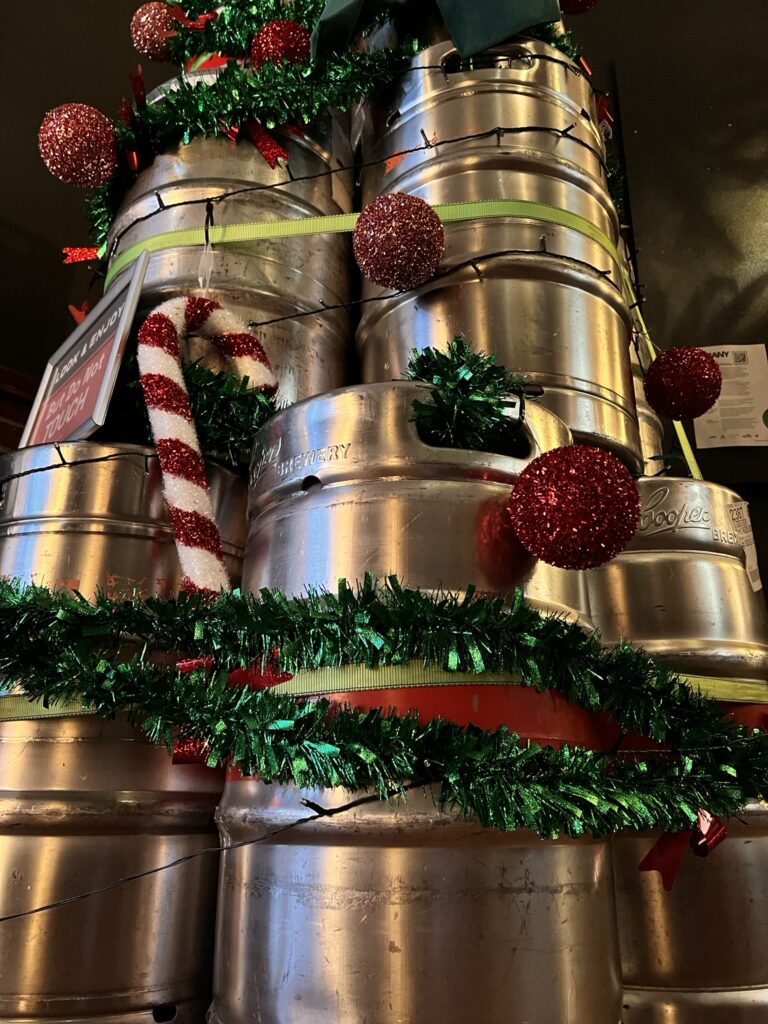 guests photo area in front of the christmas tree albany keg display at Six Degrees